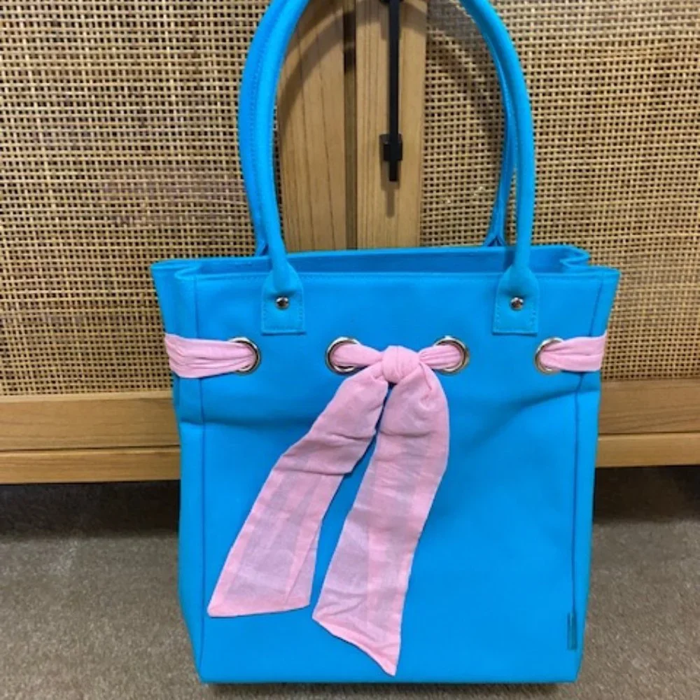 Cute bag. Blue with pink ribbon. Ralph tag. 12